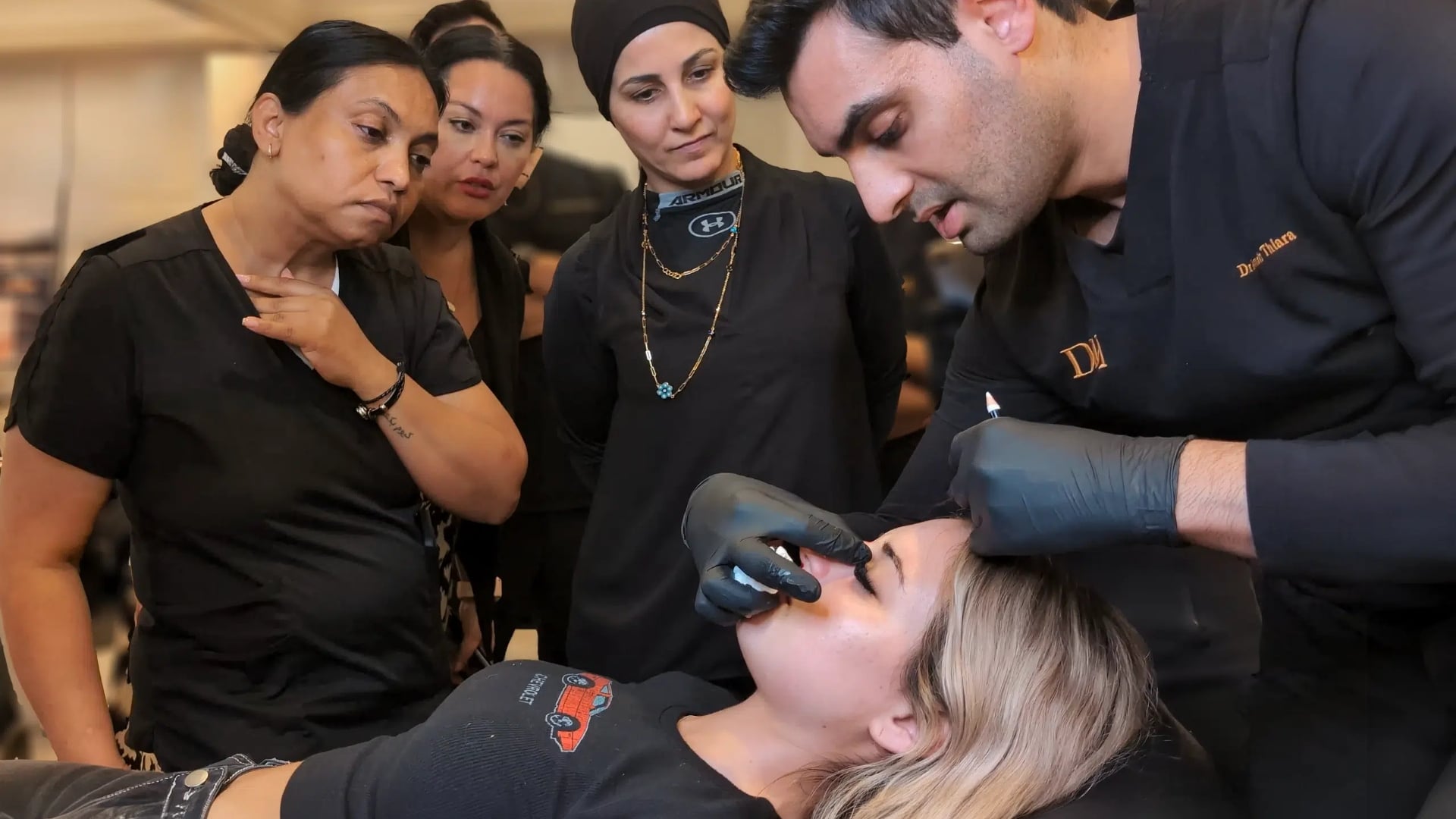 Trainer demonstrating technique to a small group